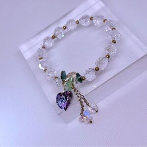 Silver and Gold Charm Bracelet with Heart and Leaf Accents